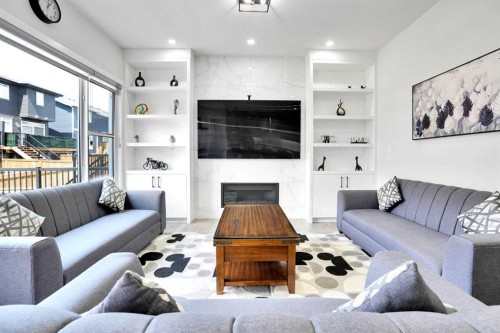 36 Waterford Terrace, Chestermere, AB - Indoor Photo Showing Living Room With Fireplace