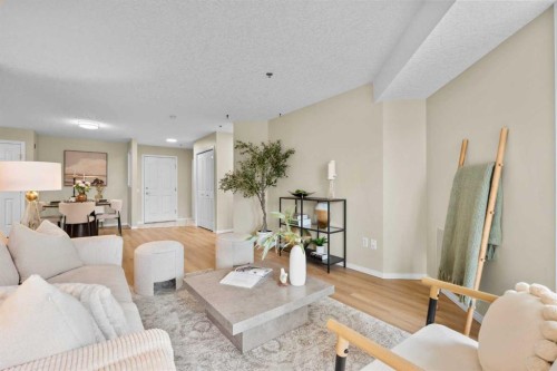 1203-1818 Simcoe Boulevard Sw, Calgary, AB - Indoor Photo Showing Living Room
