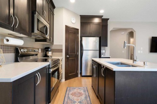 1258 New Brighton Drive Se, Calgary, AB - Indoor Photo Showing Kitchen With Stainless Steel Kitchen With Double Sink