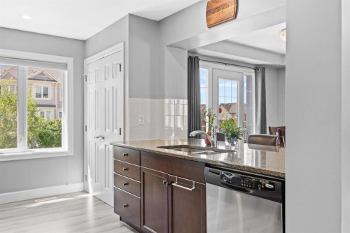 52 Windstone Green Sw, Airdrie, AB - Indoor Photo Showing Kitchen With Double Sink