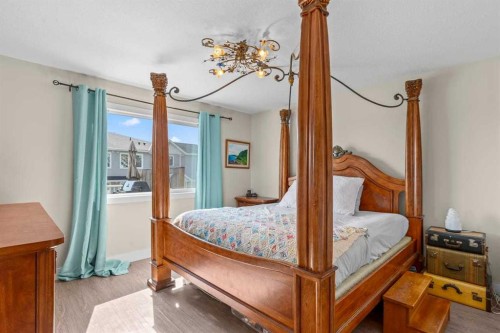 317 Mcleod Crescent, Diamond Valley, AB - Indoor Photo Showing Bedroom