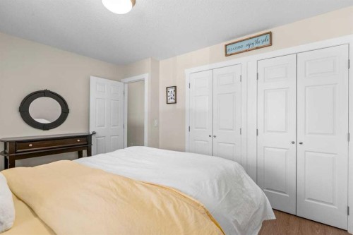 317 Mcleod Crescent, Diamond Valley, AB - Indoor Photo Showing Bedroom