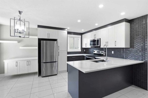 99 Pinecliff Close, Calgary, AB - Indoor Photo Showing Kitchen With Double Sink With Upgraded Kitchen