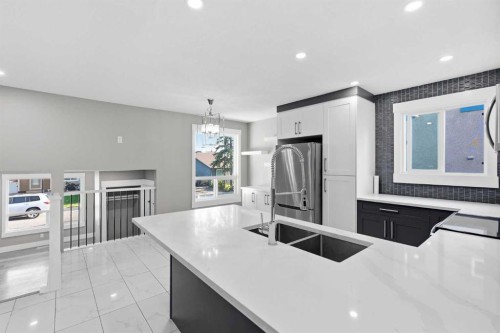 99 Pinecliff Close, Calgary, AB - Indoor Photo Showing Kitchen With Double Sink