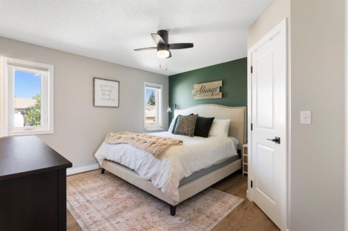 34 West Mcmanus Road, Cochrane, AB - Indoor Photo Showing Bedroom