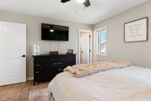 34 West Mcmanus Road, Cochrane, AB - Indoor Photo Showing Bedroom