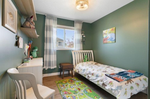 34 West Mcmanus Road, Cochrane, AB - Indoor Photo Showing Bedroom