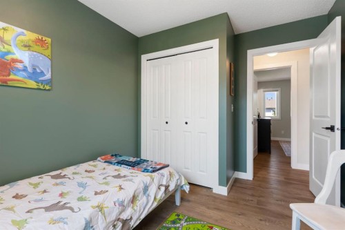 34 West Mcmanus Road, Cochrane, AB - Indoor Photo Showing Bedroom