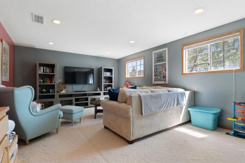 34 West Mcmanus Road, Cochrane, AB - Indoor Photo Showing Living Room