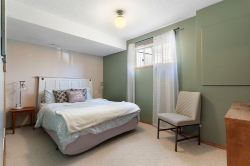 34 West Mcmanus Road, Cochrane, AB - Indoor Photo Showing Bedroom