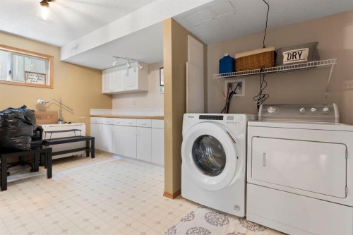 34 West Mcmanus Road, Cochrane, AB - Indoor Photo Showing Laundry Room