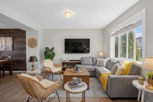 66 Canoe Close Sw, Airdrie, AB - Indoor Photo Showing Living Room