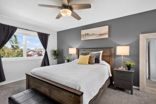 66 Canoe Close Sw, Airdrie, AB - Indoor Photo Showing Bedroom