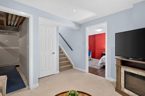 66 Canoe Close Sw, Airdrie, AB - Indoor With Fireplace