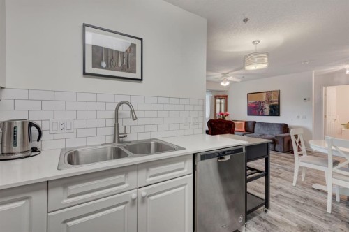 1114-1818 Simcoe Boulevard Sw, Calgary, AB - Indoor Photo Showing Kitchen With Double Sink
