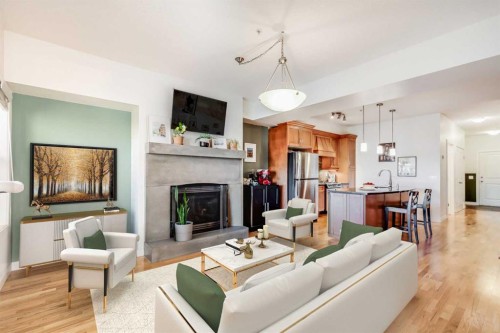 206-1818 14 Street Sw, Calgary, AB - Indoor Photo Showing Living Room With Fireplace