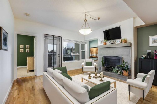 206-1818 14 Street Sw, Calgary, AB - Indoor Photo Showing Living Room With Fireplace