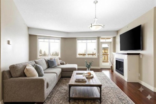 2444-2330 Fish Creek Boulevard Sw, Calgary, AB - Indoor Photo Showing Living Room With Fireplace