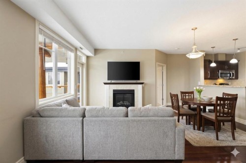 2444-2330 Fish Creek Boulevard Sw, Calgary, AB - Indoor Photo Showing Living Room With Fireplace