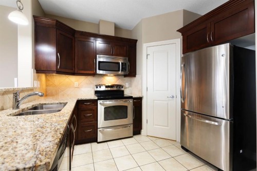 2444-2330 Fish Creek Boulevard Sw, Calgary, AB - Indoor Photo Showing Kitchen With Double Sink