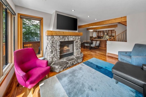 4-813 5Th Street, Canmore, AB - Indoor Photo Showing Living Room With Fireplace