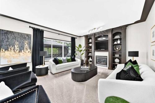 188 Hawkmere Way, Chestermere, AB - Indoor Photo Showing Living Room With Fireplace