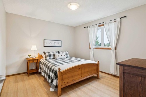 410 Millrise Drive Sw, Calgary, AB - Indoor Photo Showing Bedroom