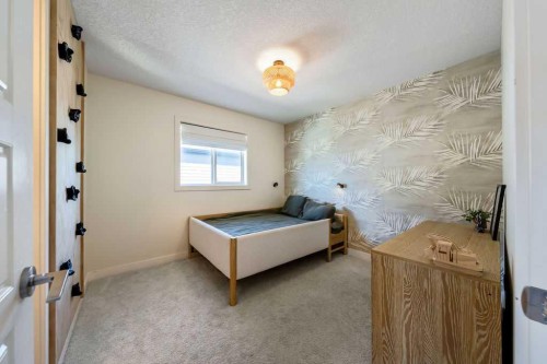 148 Rainbow Falls Glen, Chestermere, AB - Indoor Photo Showing Bedroom