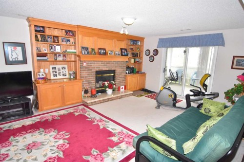 33 Strathmore Lakes Bay, Strathmore, AB - Indoor With Fireplace