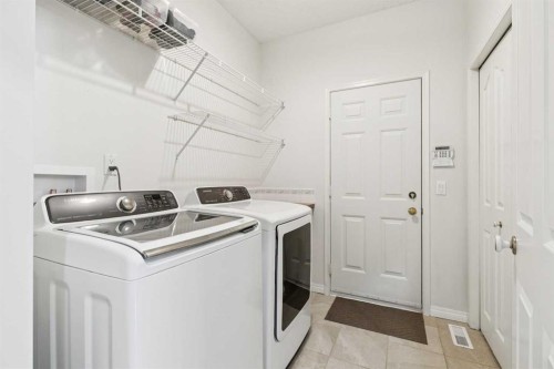 38 Edgevalley Manor Nw, Calgary, AB - Indoor Photo Showing Laundry Room