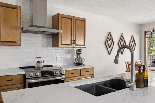 36 Cranfield Manor Se, Calgary, AB - Indoor Photo Showing Kitchen With Stainless Steel Kitchen With Double Sink With Upgraded Kitchen