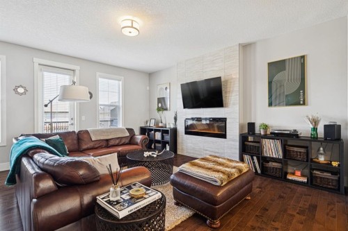 6 Quarry Lane Se, Calgary, AB - Indoor Photo Showing Living Room With Fireplace