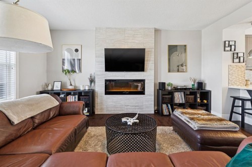6 Quarry Lane Se, Calgary, AB - Indoor Photo Showing Living Room With Fireplace