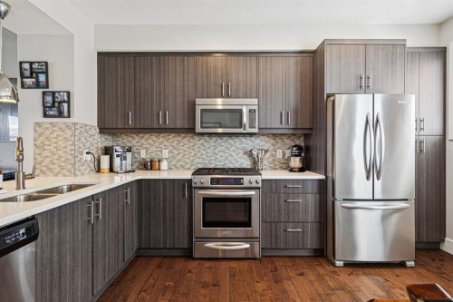 6 Quarry Lane Se, Calgary, AB - Indoor Photo Showing Kitchen With Double Sink With Upgraded Kitchen