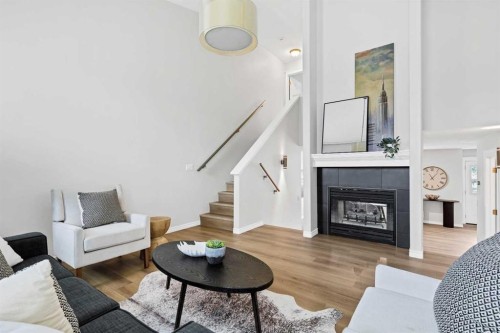 155 Prominence Heights Sw, Calgary, AB - Indoor Photo Showing Living Room With Fireplace