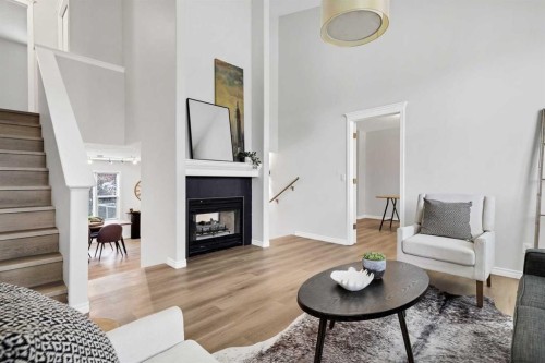 155 Prominence Heights Sw, Calgary, AB - Indoor Photo Showing Living Room With Fireplace