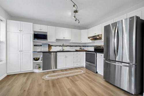 155 Prominence Heights Sw, Calgary, AB - Indoor Photo Showing Kitchen With Stainless Steel Kitchen