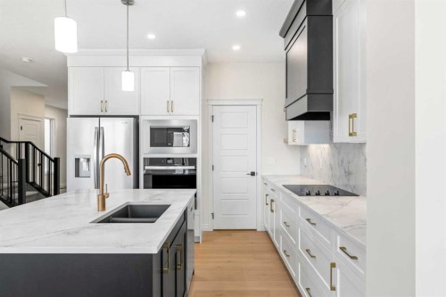 63 Annette Rise Nw, Calgary, AB - Indoor Photo Showing Kitchen With Stainless Steel Kitchen With Double Sink With Upgraded Kitchen