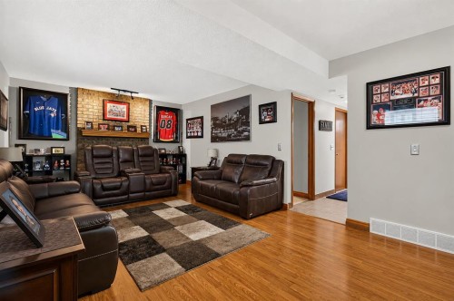 8 Erin Meadow Way Se, Calgary, AB - Indoor Photo Showing Living Room