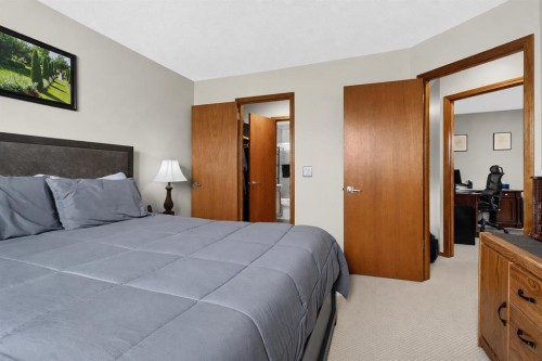 8 Erin Meadow Way Se, Calgary, AB - Indoor Photo Showing Bedroom