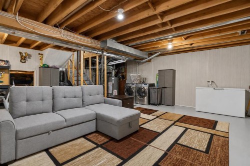 8 Erin Meadow Way Se, Calgary, AB - Indoor Photo Showing Basement