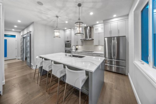 255 Gleneagles View, Cochrane, AB - Indoor Photo Showing Kitchen With Stainless Steel Kitchen With Upgraded Kitchen