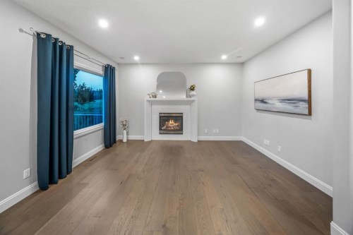 255 Gleneagles View, Cochrane, AB - Indoor With Fireplace