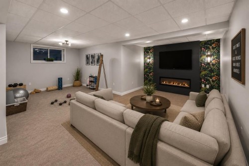 255 Gleneagles View, Cochrane, AB - Indoor With Fireplace