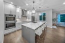 255 Gleneagles View, Cochrane, AB  - Indoor Photo Showing Kitchen With Upgraded Kitchen 
