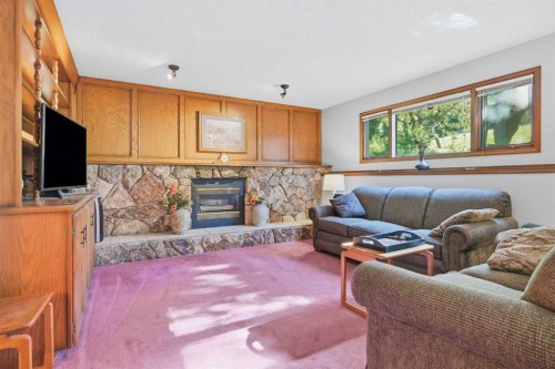 149 Edgehill Drive Nw, Calgary, AB - Indoor Photo Showing Living Room With Fireplace