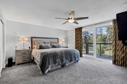 10907 Willowfern Drive Se, Calgary, AB - Indoor Photo Showing Bedroom