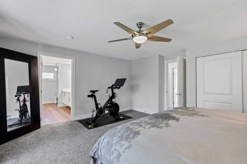 10907 Willowfern Drive Se, Calgary, AB - Indoor Photo Showing Bedroom