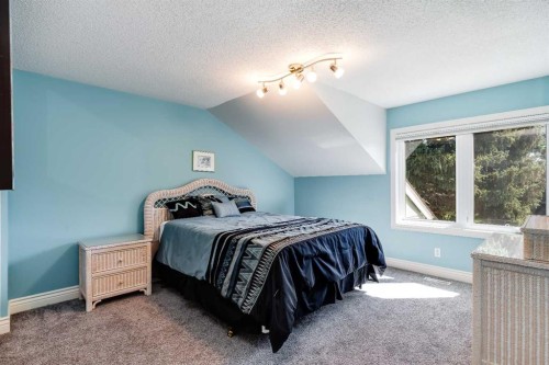 10907 Willowfern Drive Se, Calgary, AB - Indoor Photo Showing Bedroom