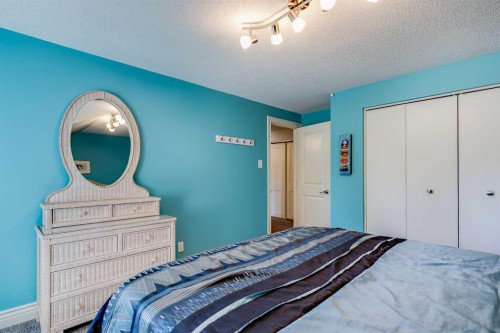 10907 Willowfern Drive Se, Calgary, AB - Indoor Photo Showing Bedroom